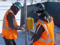 Attaching the Polar Edition Wind Data Logger to the mast.