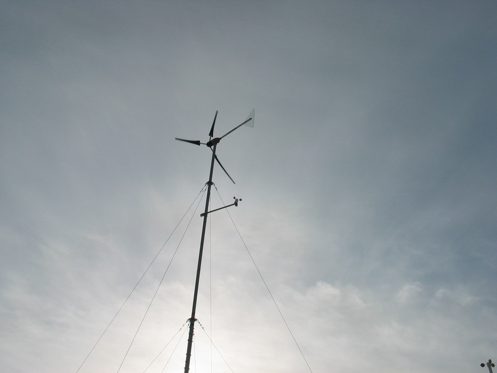 Southwest Whisper generator located on hill behind house.