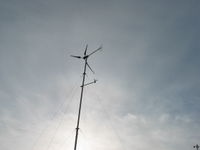 Southwest Whisper generator located on hill behind house.