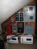 Inverters, controllers, and wiring. This off-grid hybrid solar and wind system powers a home and home business. It has evolved over 20+ years. APRS World repaired and upgraded many of the components in the system. For cost and other reasons the owners chose not to have the system upgraded to meet NEC code. Through APRS World's efforts the owners once again have ample safe and reliable energy available.