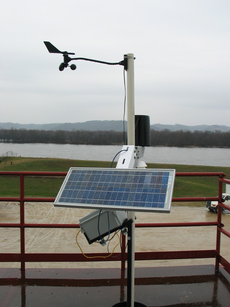 The weather station in testing outside of APRS World's shop. That is the Mississippi River in the background.