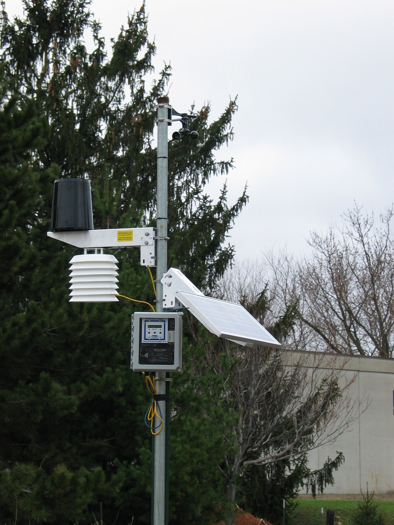 The completed weather station. Live data can be found at http://data.aprsworld.com/sites/bluffview/.

There is a computer inside the school that logs the data, displays the current weather on the school intranet, and sends that data to APRS World's server.