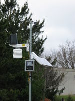 The completed weather station. Live data can be found at http://data.aprsworld.com/sites/bluffview/.

There is a computer inside the school that logs the data, displays the current weather on the school intranet, and sends that data to APRS World's server.