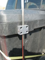 A block of PVC plastic attaches the 1/2" stainless steel tubing to the tool box. #10-24 machine screws hole the PVC block to the tool box. Anemometer height can be adjusted simply by loosening the screw on the side.