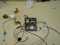 Prototype on bench. Includes anemometer, RPM sensor, load cell, current sensor, voltage inputs, and wireless connectivity. All hand assembled and quite a mess.