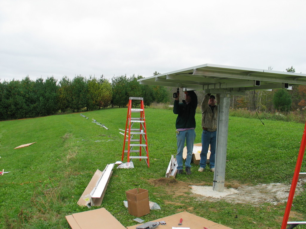 Assembling the 1kW solar array on Uni-Rac top of pole mount. We had to drill extra holes in the SolarWorld modules, but all together the assembly went really well.