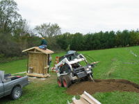 Randy with Community Electric in Lanesboro, MN trenches for the solar.