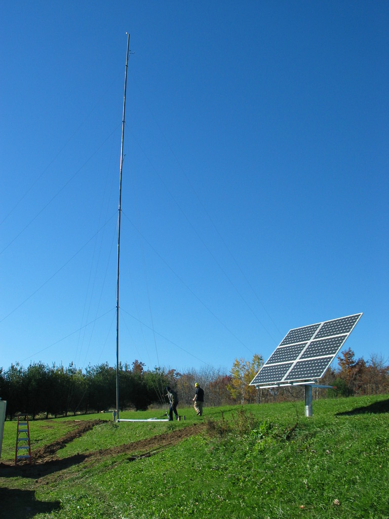 The tower was first raised without the Bergey XL.1 on top. Raising the tower was tricky because most of the guy wires were replaced and the site was not level.