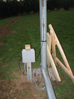 Junction box for power and wind sensor cables. Flexible conduit goes about 5 feet up the tower.