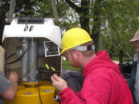 Runnning alternator output wires through flex conduit and into the slip rings. Eric Pipkin bolting the alternator on.