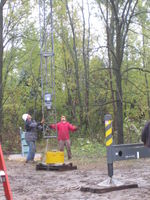 Guiding the tower onto the base pin.