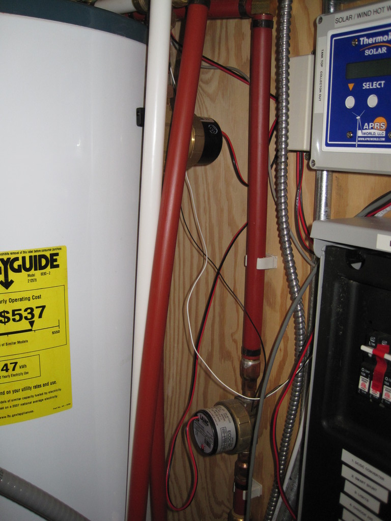 Two EcoCircs tucked up against the wall. The pump on the left ciculates through a baseboard heater for building heat. The bottom pump circulates the domestic hot water through the glycol/domestic heat exchanger.