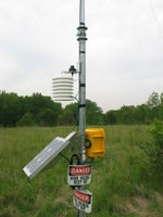 The "High Voltage" signs are supposed to prevent people from vandalizing the station. There's no high voltage involved.