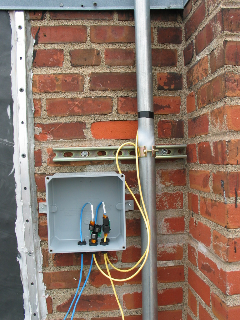 Junction box mounted to the building facade. Lots of room for wiring.
