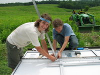 Jesse Smith (left) and Will Hesch (right) work on attaching the panels to the 2 Seas mounts. We were short lots of washers, but otherwise the mounts went together great.