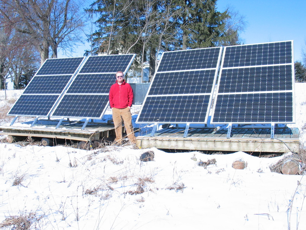 James Jarvis in front of the array, January 2007. Rated at 2.1kW, the array was producing 2096 watts when the photo was taken. This was most likely due to it being 0 degrees F.