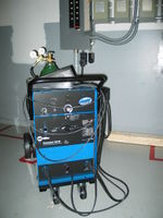Miller Syncrowave SD180 runner. 180 amp AC/DIG TIG welder. Capable of welding pretty much anything. I run straight argon shielding gas that works fine for aluminum and steel.
