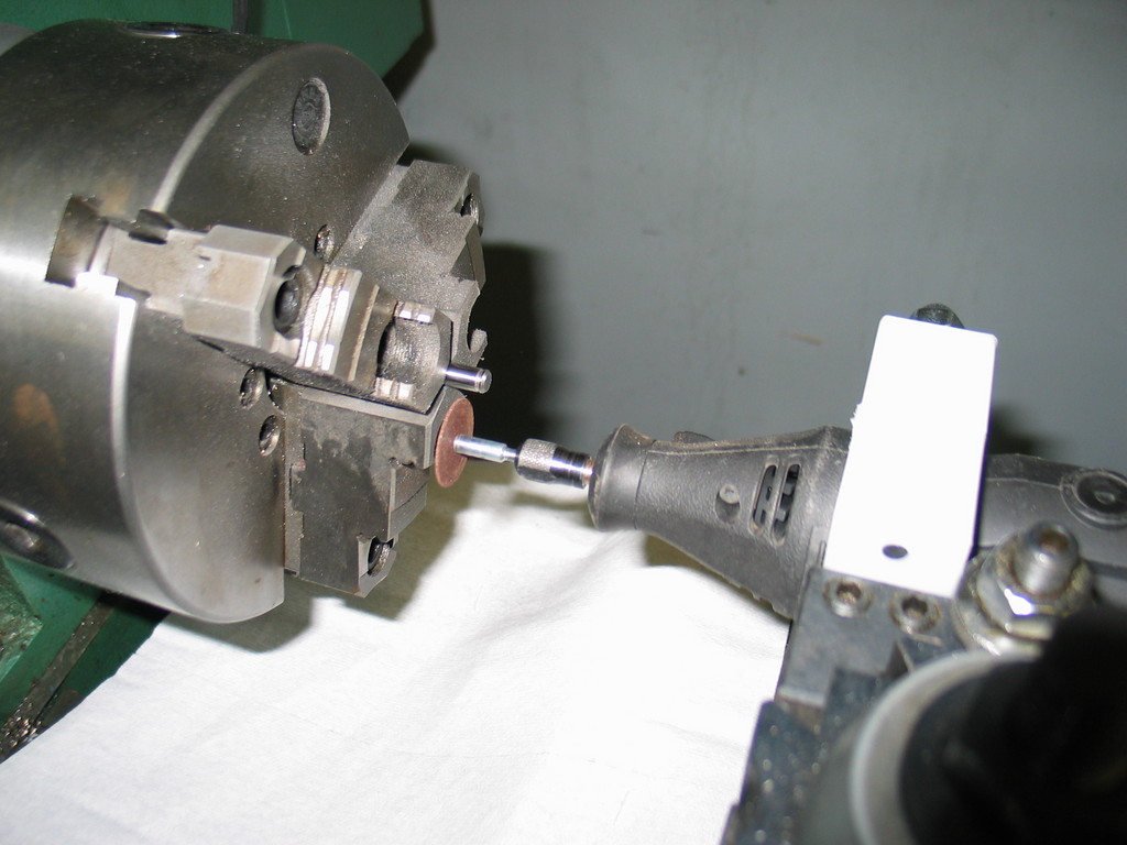 Dremel tool post grinder cutting some snap ring grooves in hardened steel shaft.