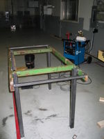 Workbench under construction. The green steel came from a discarded John Deere fixture. There was about 300 pounds more of John Deere fixture that had to be cut away first.