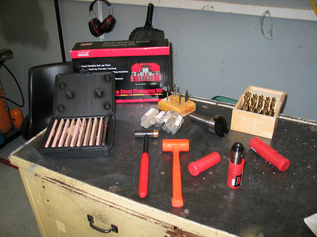 Some initial (cheap) tooling for the new CNC mill. Clamp set, thin parallels, counterbore set, lots of 1/8" and 1/4" end mills, fly cutter, end mill set, collet hammer / wrench (we'll see how well that works), dead blow hammer, 3/8" R-8 end mill holders.