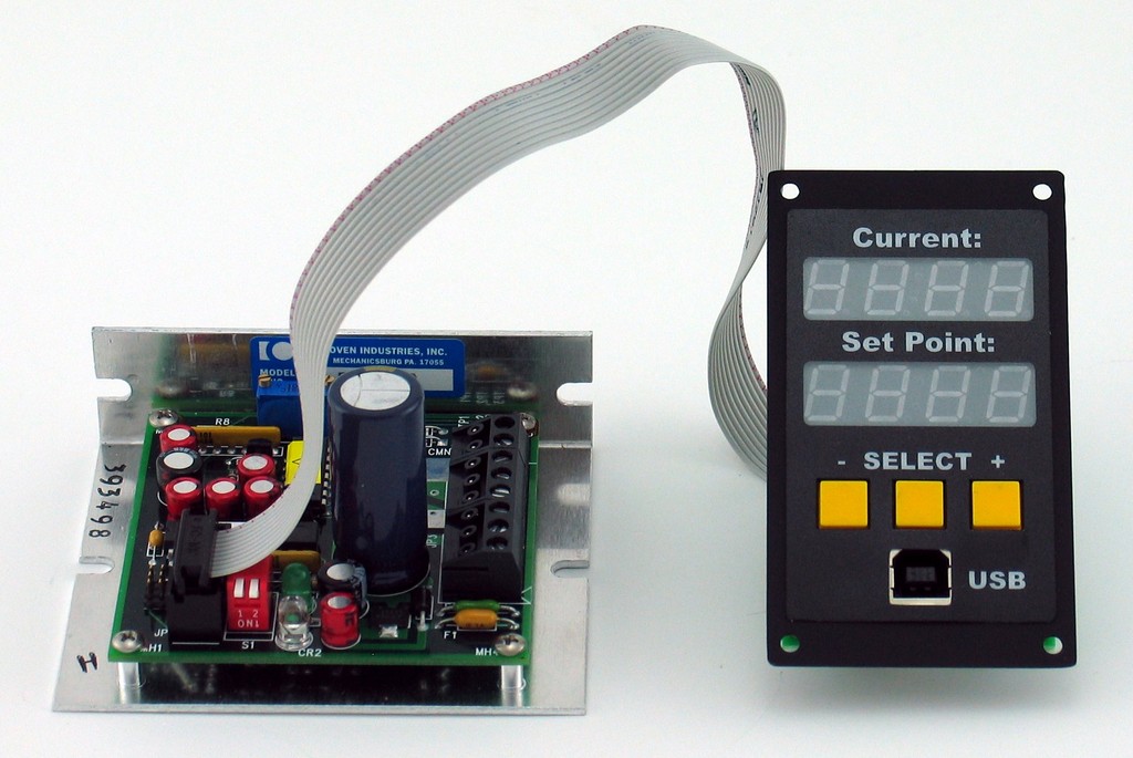 APRS World's tempLogger2 (right) with Oven Industries 5C7-550. The tempLogger2 communicates digitially with the Oven Industries controller to read the temperature. The controller set point is set using an analog signal from the tempLogger2. The tempLogger2 provides a complete and compact interface for using the Oven Industries 5C7-550 controller and logging the actual temperatures.