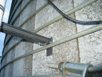 Close-up of attachment to silo band. It's not pretty, but it works.