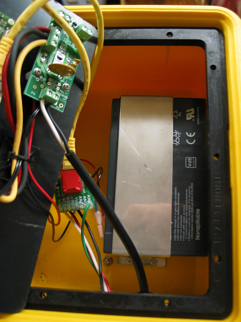 Two RJ-45 breakout boards are used to convert the 18 gauge submersible wires to RJ-45 connectors. The battery is a 7 amp hour sealed battery.
