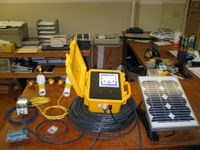 This is a custom Wind Data Logger station built for the USDA ARS. The Wind Data Logger and solar panel will be on the shore of a animal sewage lagoon. The two anemometers and the temperature sensor will float on a buoy in the lagoon. There is a 200' submersible cable that connects the shore to the bouys.
