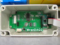 WrenDAQ2 main circuit board. There is a PIC18F2610 microcontroller (U5) in the center of the board. The passive parts on the left are low-pass filters for the anemometer and RPM inputs. The passive parts at the op-amp (U3) are low pass filters for the analog inputs. There is an onboard temperature sensor (U4). On the right is a point-of-load regulator that takes the 8 volts from the switching power supply on the other board and regulates to 5 volts. U6 is a precision 5.00 voltage reference for the ADC.