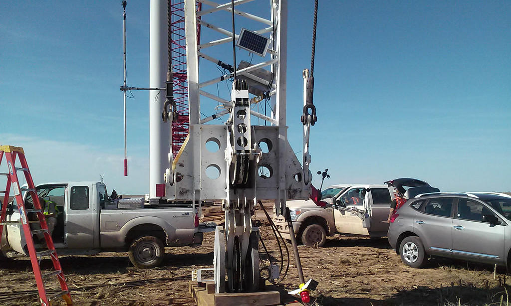 APRS World's #40HC anemometer (APRS6506) extends farthest off of the crane using a pivoting head mount (APRS7602) on right, pivoting wind vane on left