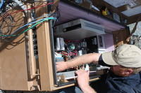 The lower electronics panel is mostly power electronics, power distribution and control relays
